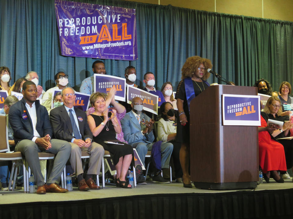 Elder Leslie Mathews, an organizer with Michigan United joins Leaders of the Reproductive Freedom for All campaign as they speak to supporters on Monday, July 11, 2022, in Lansing Mich., after turning in 753,759 signatures to qualify for Michigan's November ballot. (AP Photo/Joey Cappelletti)