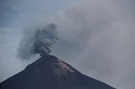 The Fuego volcano spews smoke and ash, as seen from San Miguel Los Lotes in Escuintla, Guatemala June 13, 2018. REUTERS/Luis Echeverria/Files