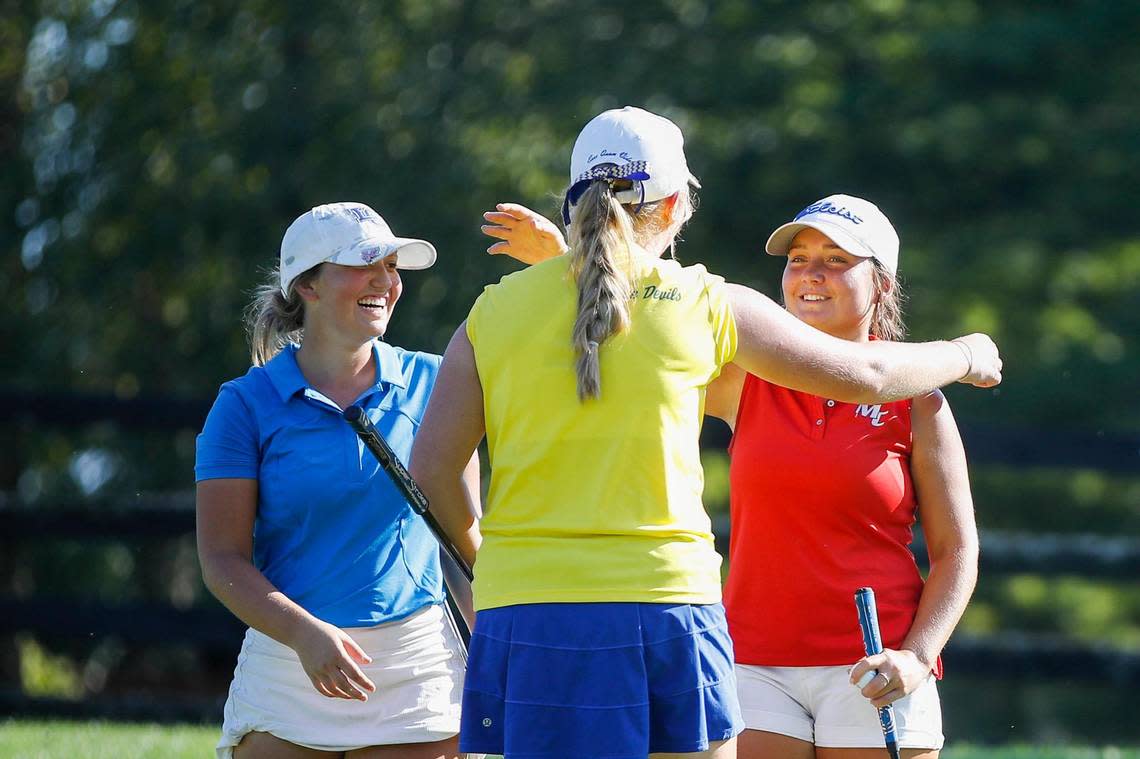 Madison Central’s Elizabeth Eberle, right, celebrates after winning a three-way playoff in the Region 9 Girls’ Golf Championship at The Woodford Club in Versailles on Tuesday. Eberle defeated Lexington Catholic’s Macy Cecil, left, and Henry Clay’s Kylah Lunsford, center, to win the two-hole playoff.