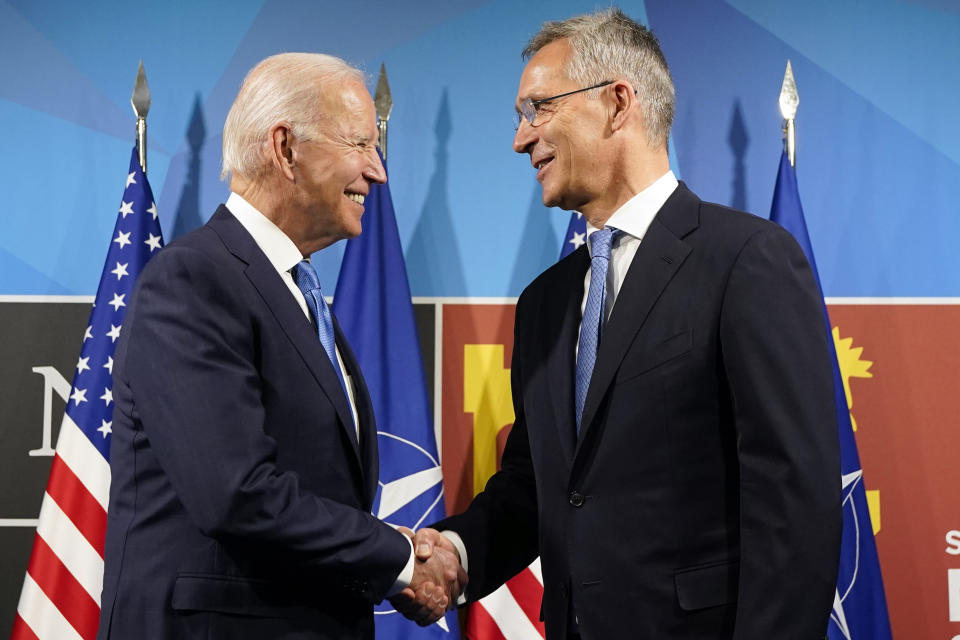 FILE - President Joe Biden, left, is greeted by NATO Secretary General Jens Stoltenberg during arrivals for a NATO summit in Madrid, Spain on Wednesday, June 29, 2022. Biden is welcoming outgoing NATO Secretary-General Jens Stoltenberg to the White House on Monday, June 12, 2023, as the competition to find his successor to lead the military alliance heats up. Stoltenberg, who has led NATO since 2014 indicated earlier this year he would move on when his term expires at the end of September. (AP Photo/Susan Walsh, File)