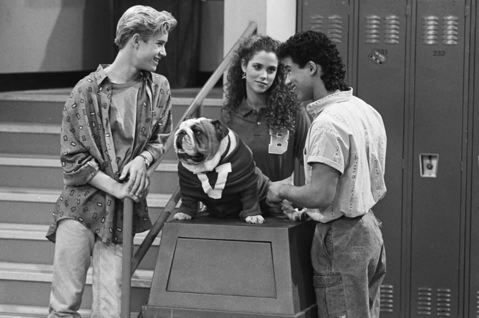 SAVED BY THE BELL -- "Save That Tiger" Episode 16 -- Air Date 12/16/1989 -- Pictured: (l-r) Mark-Paul Gosselaar as Zachary 'Zack' Morris, Elizabeth Berkley as Jessie Spano, Mario Lopez as A.C. Slater -- Photo by: Chris Haston/NBCU Photo Bank