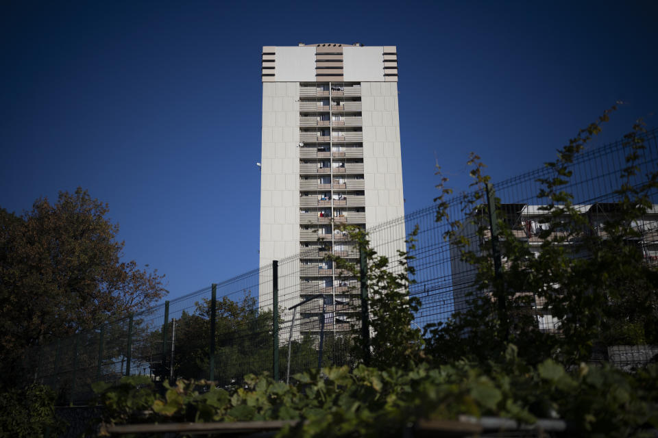 The tower block of the Cité Font Vert is pictured from a communal garden in Marseille, southern France, Saturday, Oct. 23, 2021. Urban gardens are sprouting hope in drug- and violence-plagued neighborhoods of Marseille. From publicly funded city-wide initiatives to residents taking it upon themselves to start cultivating the land around them, urban farming is changing the landscape and creating a space for community. (AP Photo/Daniel Cole)