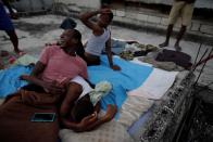 The Wider Image: Haiti's cyclists brave protests and poor roads in race for gold