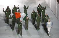 Ireland's flag-bearer Conor Lyne leads his country's contingent during the opening ceremony of the 2014 Sochi Winter Olympics, February 7, 2014. REUTERS/Lucy Nicholson (RUSSIA - Tags: OLYMPICS SPORT)