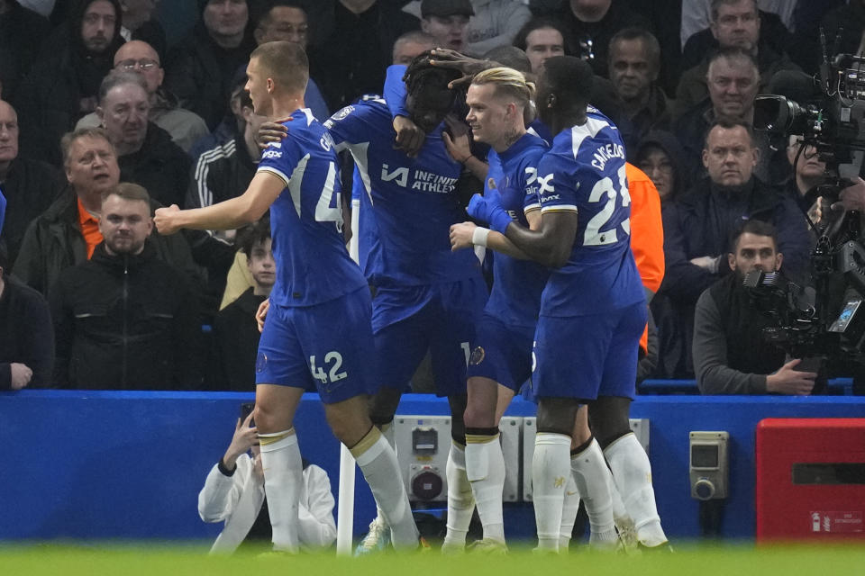 Chelsea's Trevoh Chalobah, centre, celebrates after scoring his side's opening goal during the English Premier League soccer match between Chelsea and Tottenham Hotspur at Stamford Bridge stadium in London, Thursday, May 2, 2024. (AP Photo/Kirsty Wigglesworth)