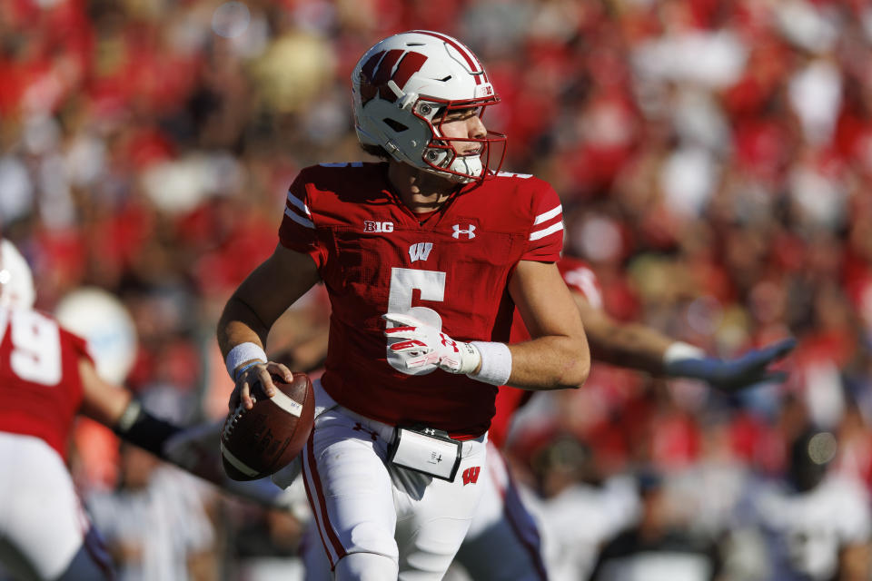 Oct 22, 2022; Madison, Wisconsin, USA; Wisconsin Badgers quarterback Graham Mertz (5) looks to throw a pass during the second quarter against the Purdue Boilermakers at Camp Randall Stadium. Mandatory Credit: Jeff Hanisch-USA TODAY Sports