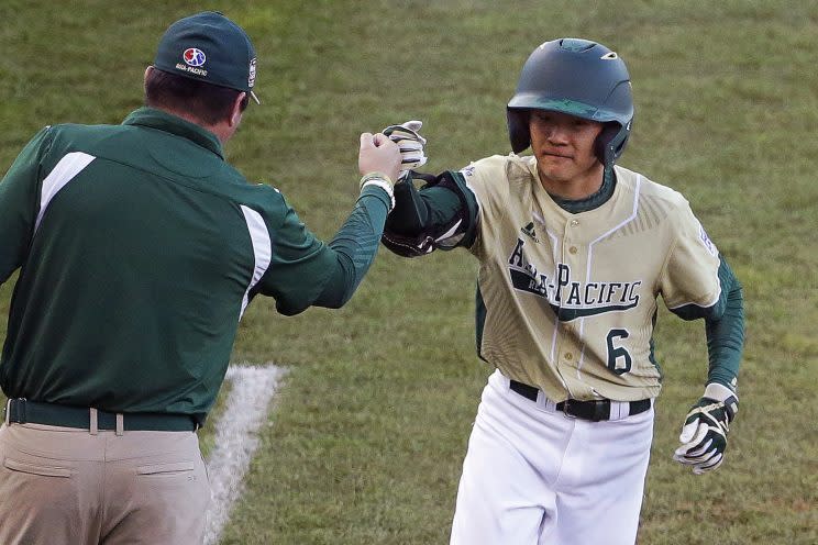 South Korea's Jungtaek Ru (6) rounds third after a three-run home run during the fourth inning of a baseball game against Canada in International pool play at the Little League World Series tournament in South Williamsport, Pa., Monday, Aug. 22, 2016. (AP Photo/Gene J. Puskar)