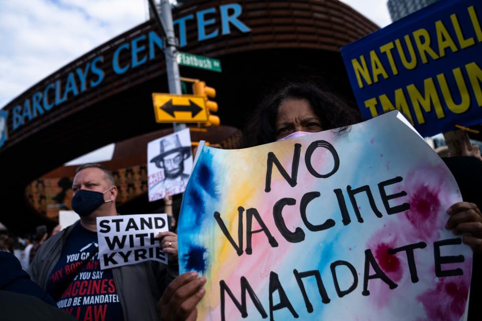 Protesters rally against COVID-19 vaccination mandates outside the Barclays Center before an NBA basketball game between the Brooklyn Nets and the Charlotte Hornets on Oct. 24, 2021, in New York. (AP Photo/John Minchillo)