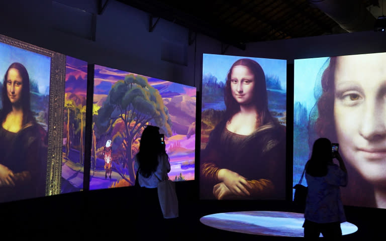 達文西名作《蒙娜麗莎》也被放上5公尺巨幕，搭配光影變化與音樂打造沉浸式體驗。（圖／魏妤靜攝）