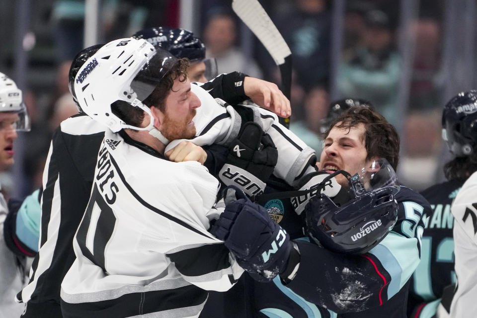 Seattle Kraken left wing Tye Kartye, right, fights with Los Angeles Kings center Pierre-Luc Dubois, left, during the second period of an NHL hockey game Saturday, Dec. 16, 2023, in Seattle. (AP Photo/Lindsey Wasson)