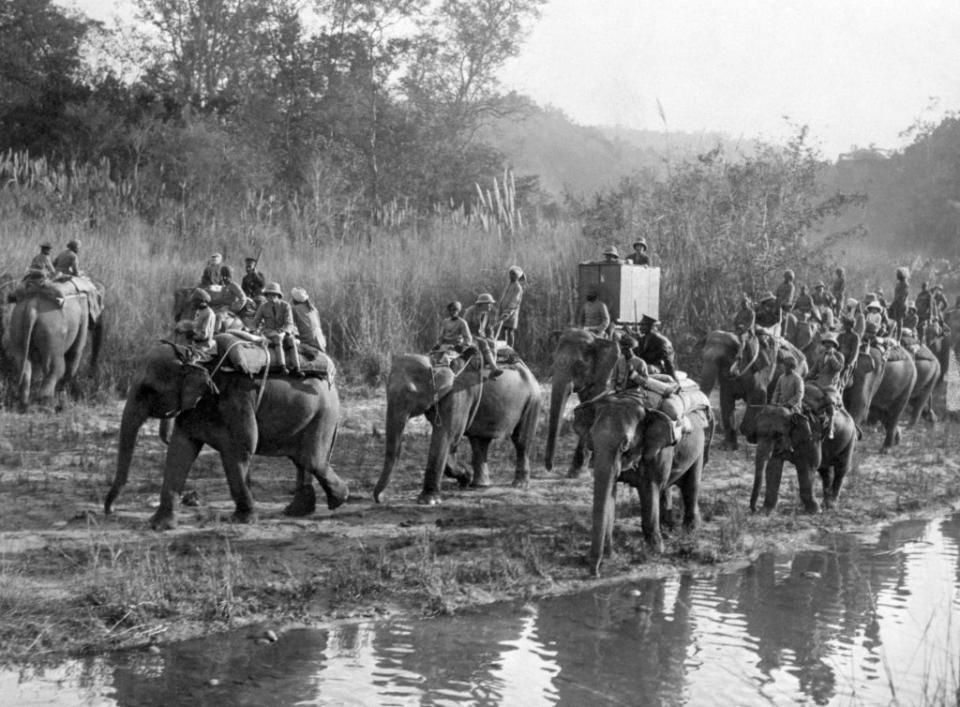 The prince rides an elephant on the way to a tiger shoot in Nepal (PA)