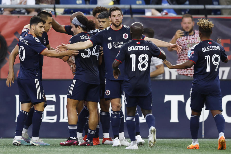 The New England Revolution celebrate a goal by Bobby Wood, second from left, during the first half of an MLS soccer match against the Toronto FC, Saturday, June 24, 2023, in Foxborough, Mass. (AP Photo/Michael Dwyer)