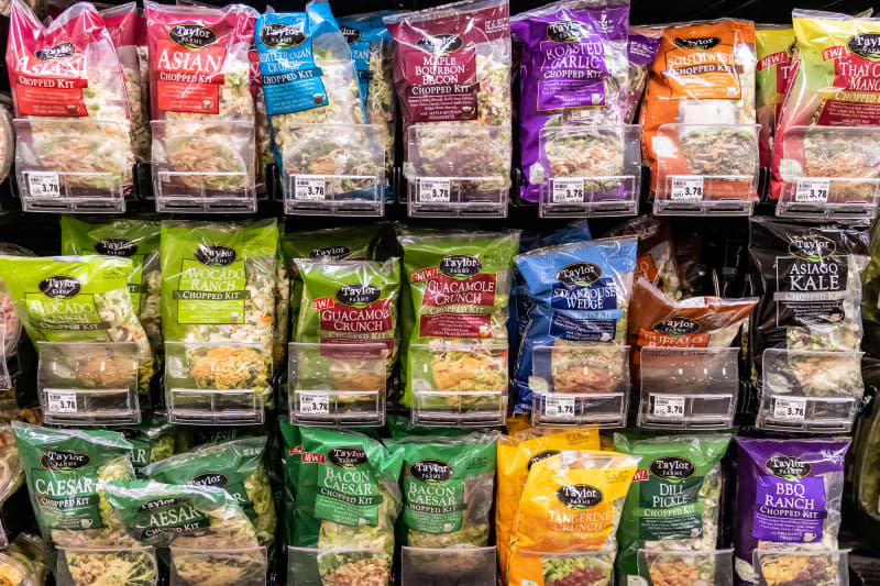 Taylor brands Bagged assorted organic salads kits for sale in a supermarket aisle