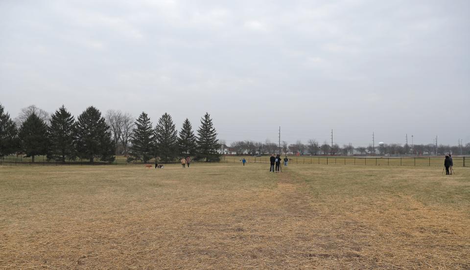 Dogs play in the new park during the ribbon cutting, Thursday, Dec. 8, 2022, at Cumberland Dog Park in West Lafayette, Ind. 
