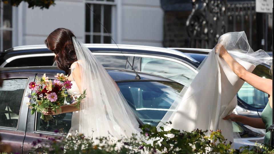 Michelle Dockery's bridesmaid holding up her train