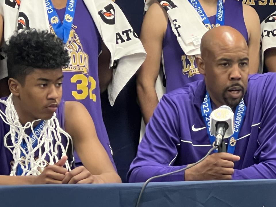 Jason Crow Jr. (left) and his father coach, Jason Crowe Sr. of Lynwood after winning state Division V championship.