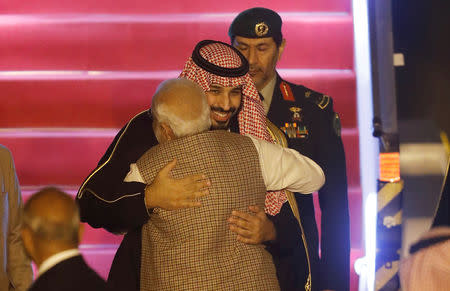 Saudi Arabia's Crown Prince Mohammed bin Salman hugs India’s Prime Minister Narendra Modi upon his arrival at an airport in New Delhi, India, February 19, 2019. REUTERS/Adnan Abidi