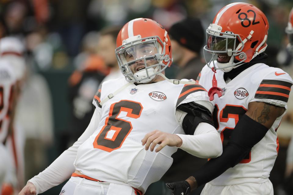 Cleveland Browns' Baker Mayfield and Blake Hance have some fun before an NFL football game against the Green Bay Packers Saturday, Dec. 25, 2021, in Green Bay, Wis. (AP Photo/Aaron Gash)