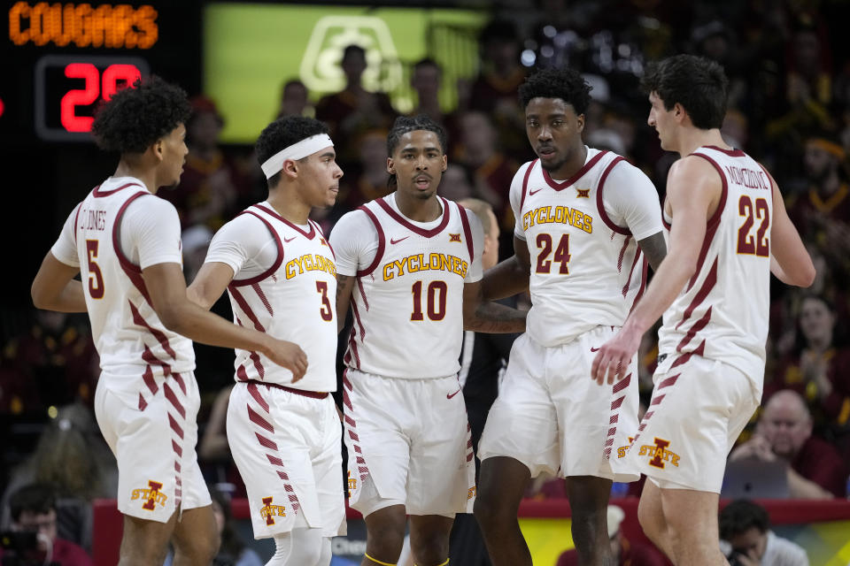 Iowa State guards Curtis Jones (5), Tamin Lipsey (3), Keshon Gilbert (10) and forwards Hason Ward (24) Milan Momcilovic (22) huddle up after a foul was charged to BYU during the first half of an NCAA college basketball game, Wednesday, March 6, 2024, in Ames, Iowa. (AP Photo/Matthew Putney)