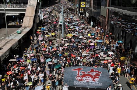 Anti-extradition bill protesters march during the anniversary of Hong Kong's handover to China in Hong Kong