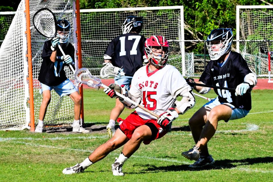 St. Andrew's Connor Hofbauer does roundabout to bring the ball closer for the goal shot in a regional final game against St. John Paul II on May 4, 2024.