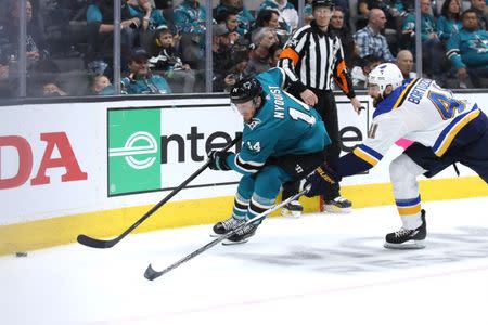 May 19, 2019; San Jose, CA, USA; San Jose Sharks center Gustav Nyquist (14) skates with the puck as St. Louis Blues defenseman Robert Bortuzzo (41) applies pressure during the third period in Game 5 of the Western Conference Final of the 2019 Stanley Cup Playoffs at SAP Center at San Jose. Mandatory Credit: Darren Yamashita-USA TODAY Sports