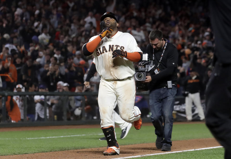 San Francisco Giants' Pablo Sandoval celebrates after hitting a solo home run against the Chicago Cubs during the 13th inning of a baseball game in San Francisco, Tuesday, July 23, 2019. The Giants won 5-4 in 13 innings. (AP Photo/Jeff Chiu)