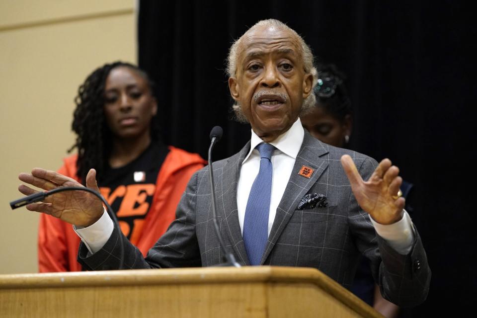 CORRECTS THAT PERSON AT REAR IS NNEKA OGWUMIKE, INSTEAD OF TERRI JACKSON - The Rev. Al Sharpton speaks during a news conference in Chicago, Friday, July 8, 2022. Cherelle Griner, the wife of WNBA star Brittney Griner, joined Sharpton and WNBA players, including Los Angeles Sparks' Nneka Ogwumike, rear, and union leader Terri Jackson a day after Brittney Griner pleaded guilty to drug possession charges in a Russian court. (AP Photo/Nam Y. Huh)