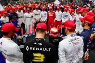 FILE PHOTO: Drivers observe a minute's silence in tribute to late Formula One legend Niki Lauda at the Circuit de Monaco in Monte Carlo ahead of the Monaco Grand Prix.
