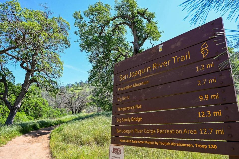 The San Joaquin River Trail marker is posted at the trailhead at the South Finegold Picnic Area on Millerton Lake. The trail is a great spot to see wildflowers in the spring.
