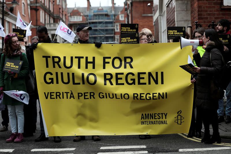 FILE PHOTO: Demonstrators from Amnesty International hold placards outside the Egyptian embassy in support of Giulio Regeni, who was found murdered in Cairo two years ago, in London