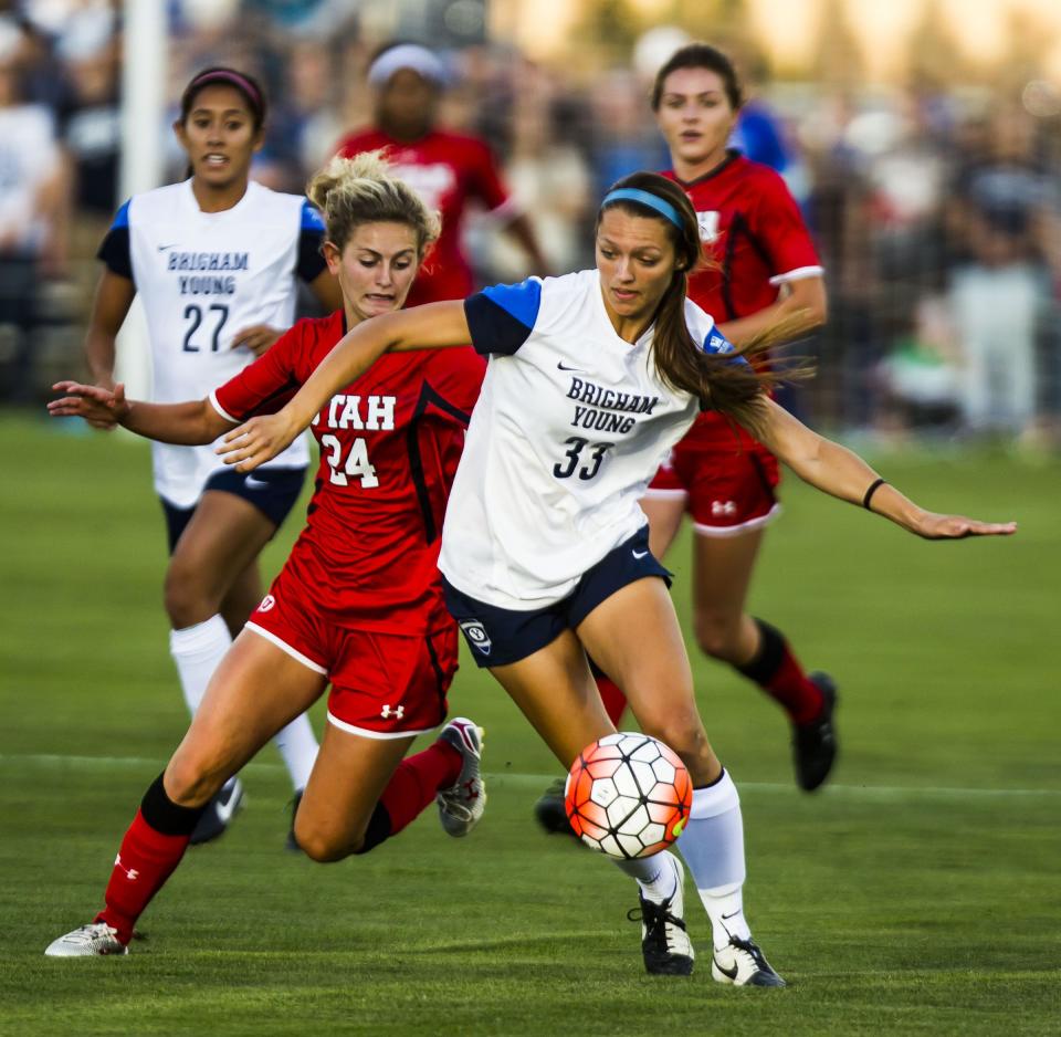 20150905 Utah’s Eden Jacobsen (24) and BYU’s Ashley Hatch (33) fight for the ball during the BYU Cougars’ and Utah Utes’ soccer game at BYU in Provo on Friday, Sept. 4, 2015. | Stacie Scott, Deseret News