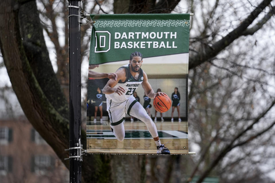 A poster of a basketball player is attached to a lamppost on the campus of Dartmouth College, Tuesday, March 5, 2024, in Hanover, N.H. Dartmouth basketball players voted to form a union, an unprecedented step in the continued deterioration of the NCAA's amateur business model. (AP Photo/Robert F. Bukaty)