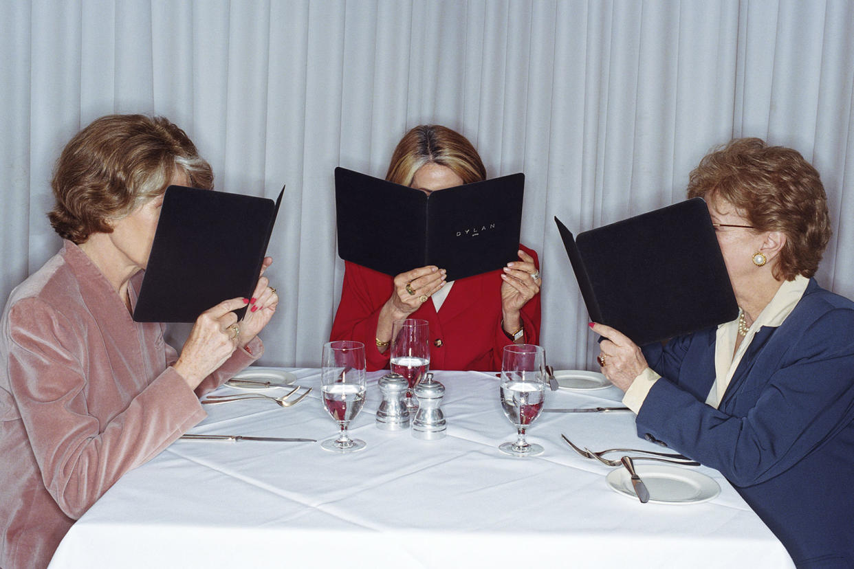 Women looking at the menu in restaurant Getty Images/Emmanuel Faure