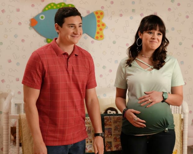 Sam Lerner as Geoff Schwartz and Hayley Orrantia as a pregnant Erica Goldberg in Season 10 of "The Goldbergs"<p>ABC</p>