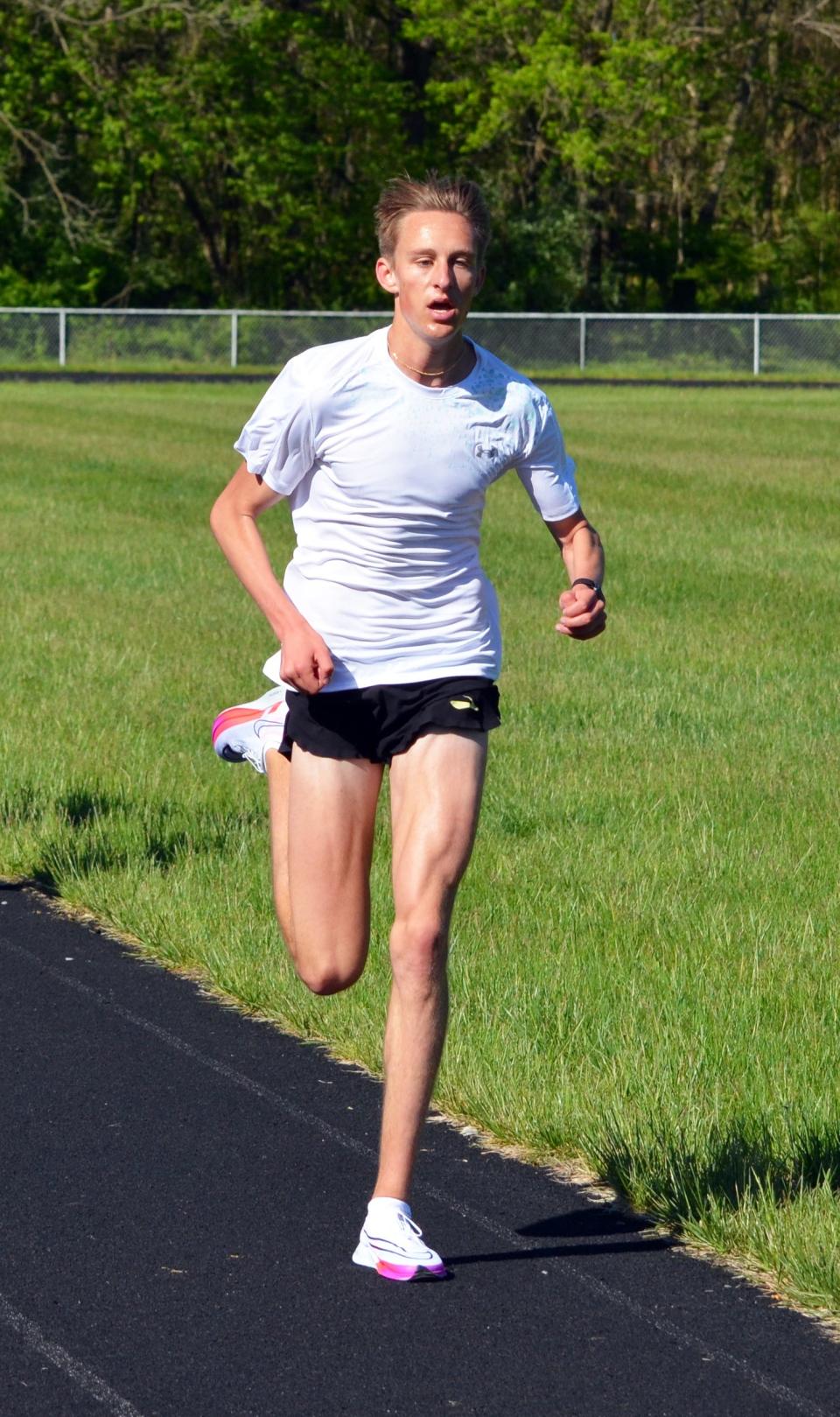 David Butts trains on the track at Hagerstown Community College.