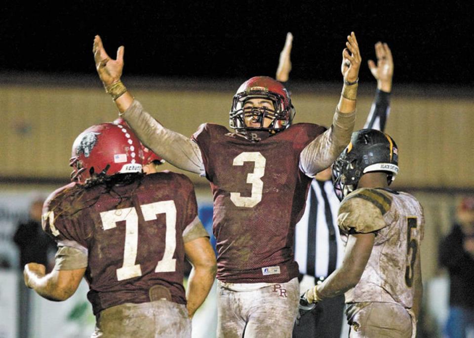 Paso Robles High’s Richards Flores (77), Josh Oliver (3) and the rest of the Bearcats have had plenty to celebrate in 2014, including a CIF-Southern Section Northern Division championship win over Newbury Park.