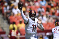 Washington Commanders quarterback Carson Wentz (11) passes during the first half of a preseason NFL football game against the Carolina Panthers, Saturday, Aug. 13, 2022, in Landover, Md. (AP Photo/Nick Wass)