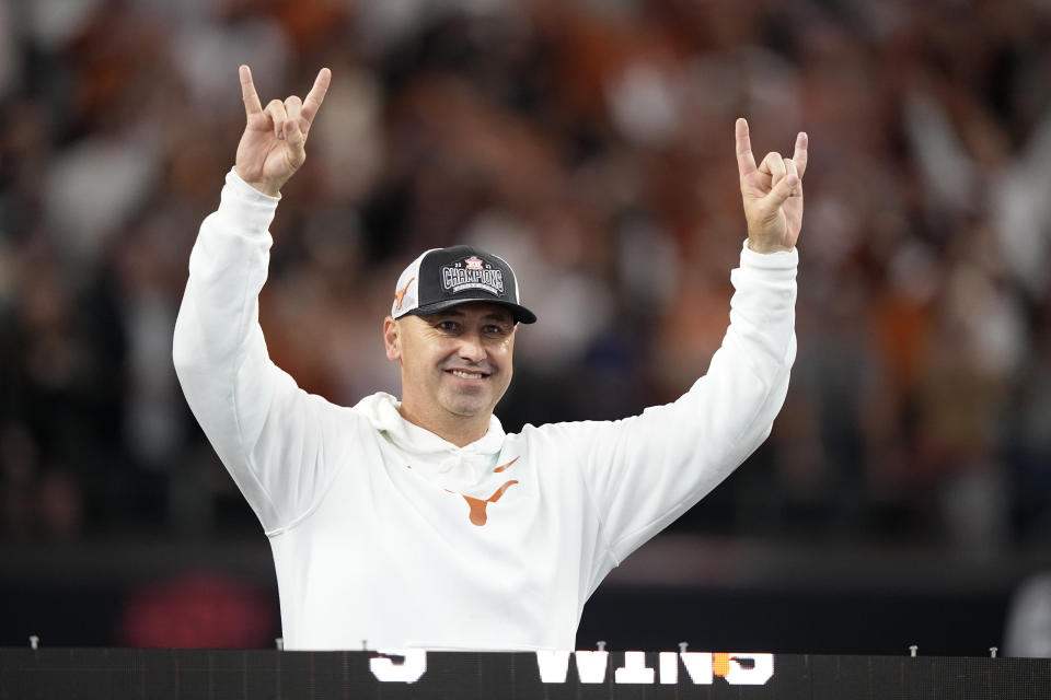 Texas head coach Steve Sarkisian celebrates after his team won the Big 12 Conference championship NCAA college football game against Oklahoma State in Arlington, Texas, Saturday, Dec. 2, 2023. (AP Photo/Tony Gutierrez)