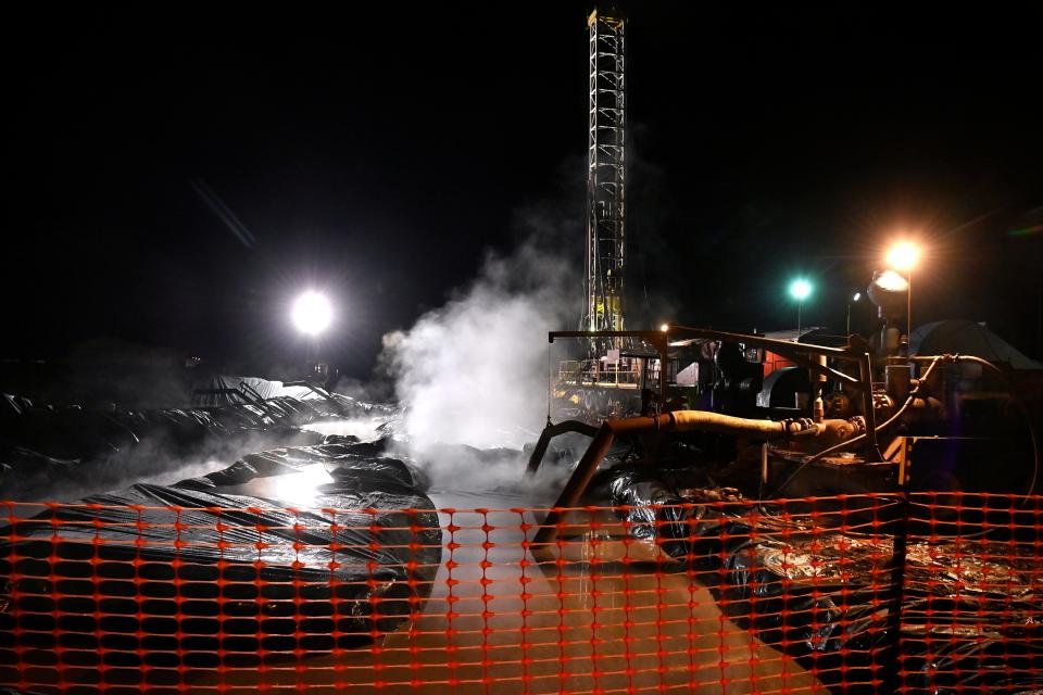 Steam drifts across the work site as water used in the oil drilling process pours into retention ponds in the 2400 block of Burger St. Jan. 3.