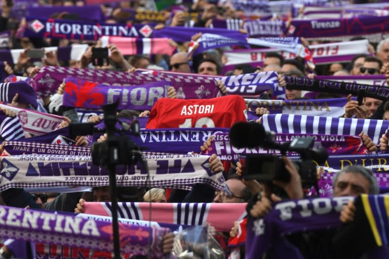 Fiorentina's supporters pay hommage to club captain Davide Astori during his funeral in Florence