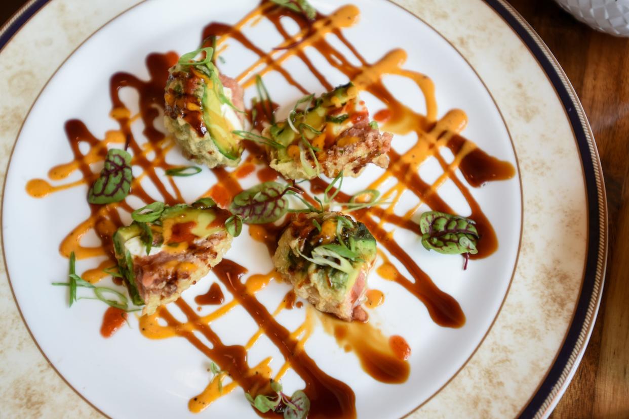 Teak OTR calls this appetizer "Monkey Brain." It's fried avocado stuffed with sushi and cream cheese.