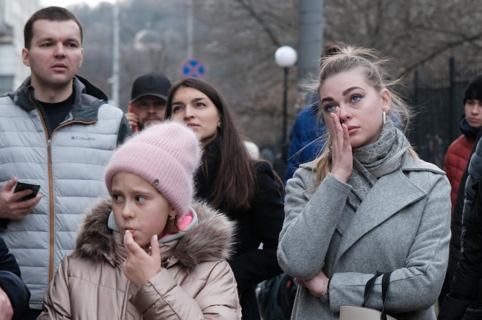 Kyiv residents look upon a destroyed building that was struck by a Russian missile on New Year’s Day (Getty Images)