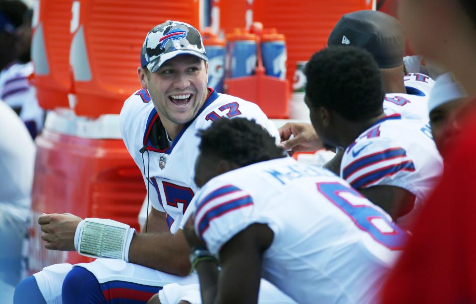 Bills quarterback Josh Allen shares a laugh with his receivers on the bench during the Bills preseason game against Denver Saturday, Aug. 20, 2022 at Highmark Stadium.  Buffalo won the game 42-15.