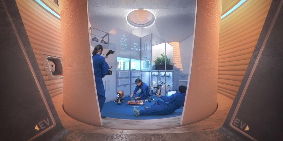 A peek inside one of the 3D-printed homes shows a family in their living room.