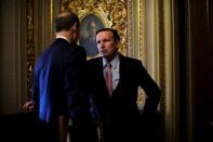 U.S. Senators Ron Wyden (D-OR) and Chris Murphy (D-CT) talk at the Capitol as fallout continued over U.S. President Donald Trump's Helsinki summit with Russian President Vladimir Putin, in Washington, U.S., July 17, 2018. REUTERS/James Lawler Duggan