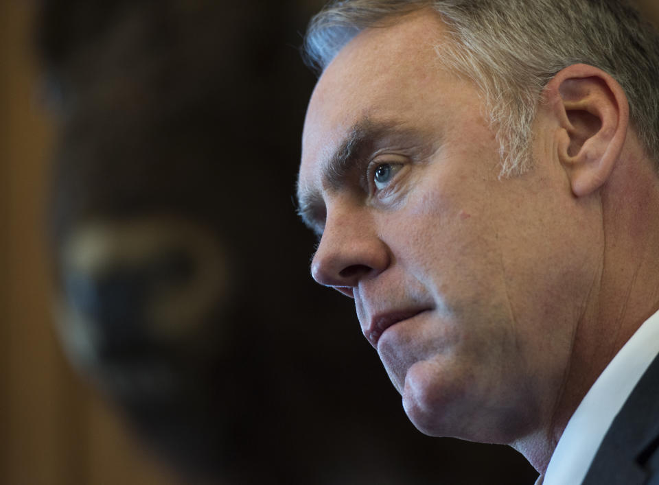 Interior Secretary Ryan Zinke speaks at the Interior Department in Washington, Wednesday, March 29, 2017. Zinke said geographic and physical challenges will make it difficult to build the "big, beautiful wall" that President Donald Trump has promised on the U.S.-Mexico border. (AP Photo/Molly Riley)