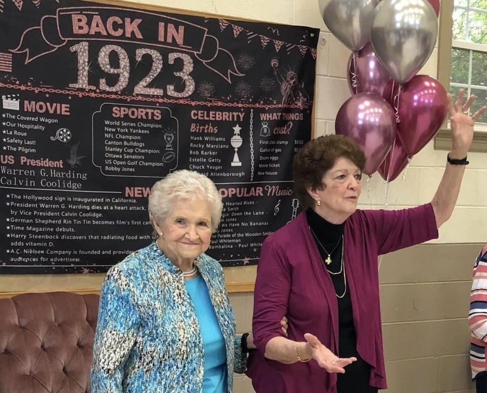On the right, Nancy Stanton McDaniel welcomes guests to her mom Arlene Layne Stanton's 100th birthday party in Chester, Va. on December 28.