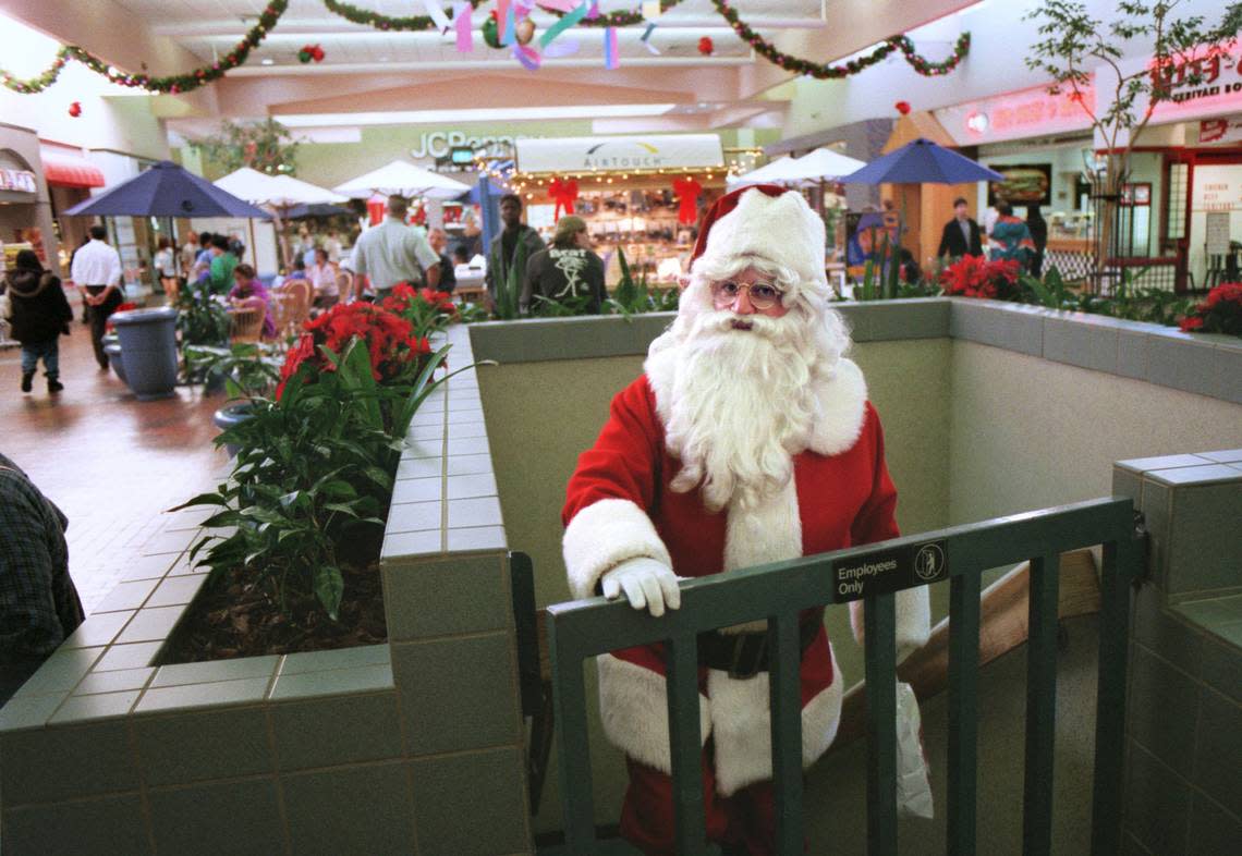 Santa Claus emerges at Florin Mall on his way to visit children in 1999. John DeLong said he enjoyed the job and the kids were great. OWEN BREWER/Sacramento Bee file