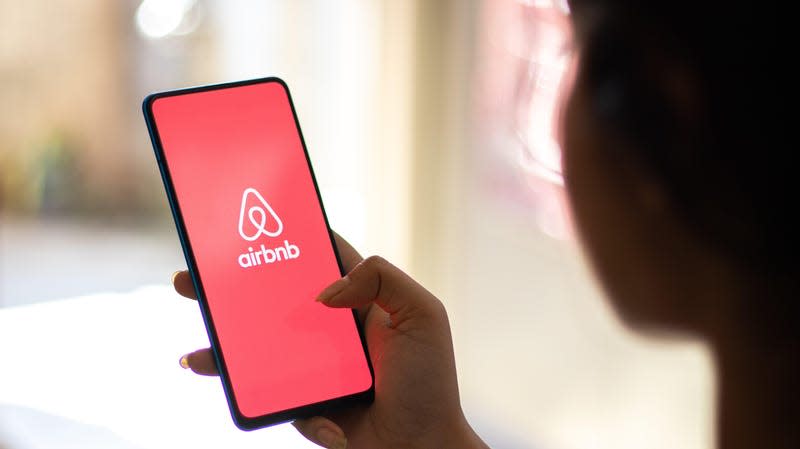 Stock image of Airbnb logo on phone